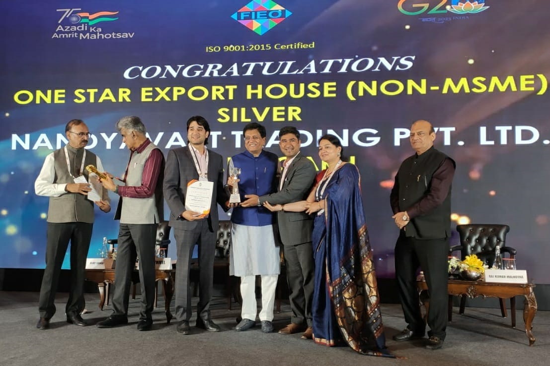 Photo of Nandyavart Group receiving Silver Trophy from Honorable Commerce Minister Shri Piyush Goyal ji