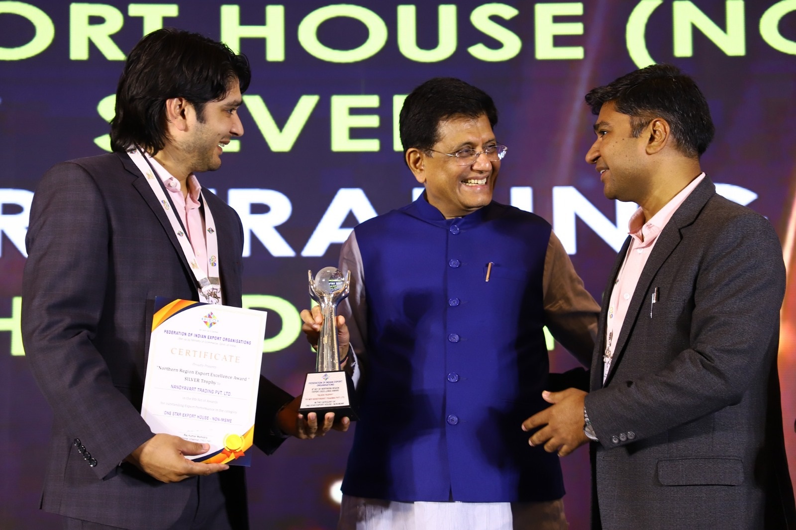 Photo of Nandyavart Group receiving Export Excellence Silver Trophy award