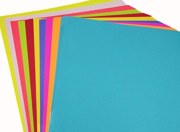 Stack of vibrant Color Printing Paper for graphic design and high-quality prints